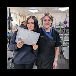 Student receiving her platinum certificate on her dog grooming course Banbury