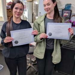 Students achieving their palticnum certificates at a dog grooming school Worcester